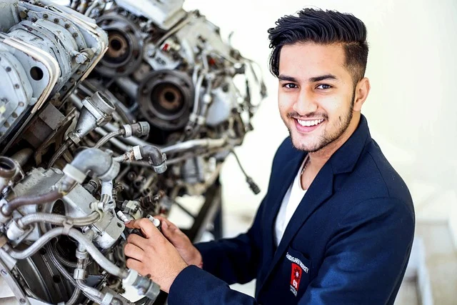 Young male engineer at work on an engine