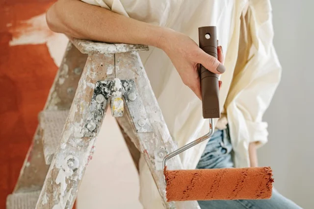 Woman's hand holding paintbrush