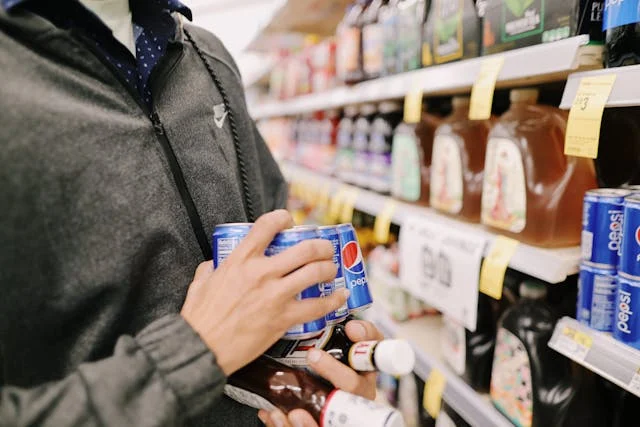 Man gathering items in supermarket