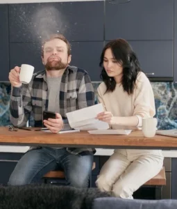 Man reacts in shock as tax adviser points out an error